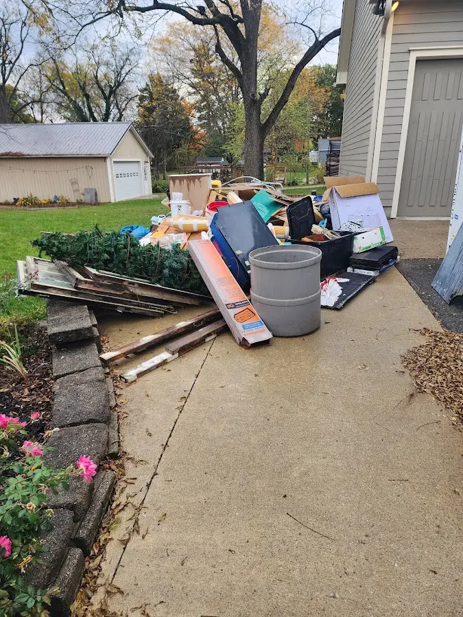 Dumpster being loaded with debris for 3 Yard Dumpster Rental in Mascoutah